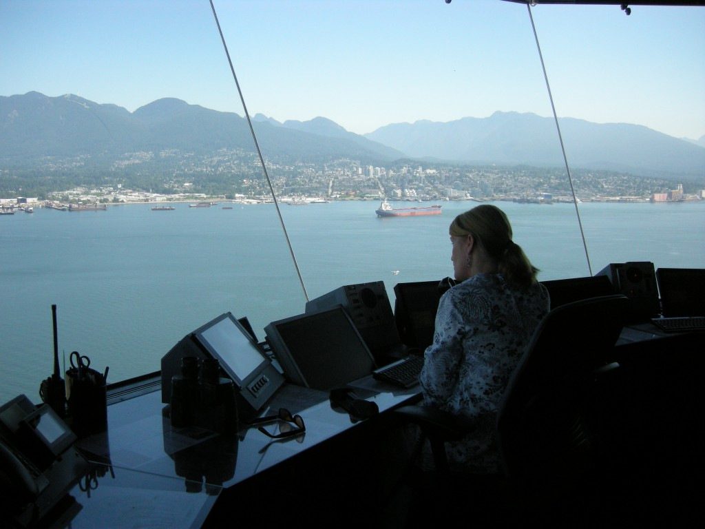Kim Marshall working YHC’s air traffic, on a gorgeous summer day. If you look carefully, you can see a floatplane about to touch down, just above Kim’s monitors.