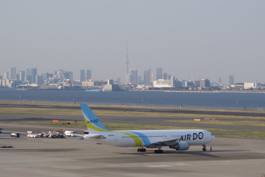 Air Do 767 on the T2 ramp, with Tokyo in the distance