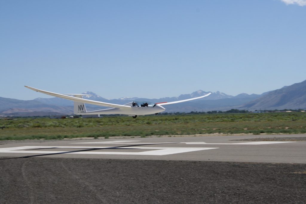 With airbrakes out, a Duo Discus is about to touch down on Runway 30 at Minden-Tahoe Airport - Photo: Soaring NV