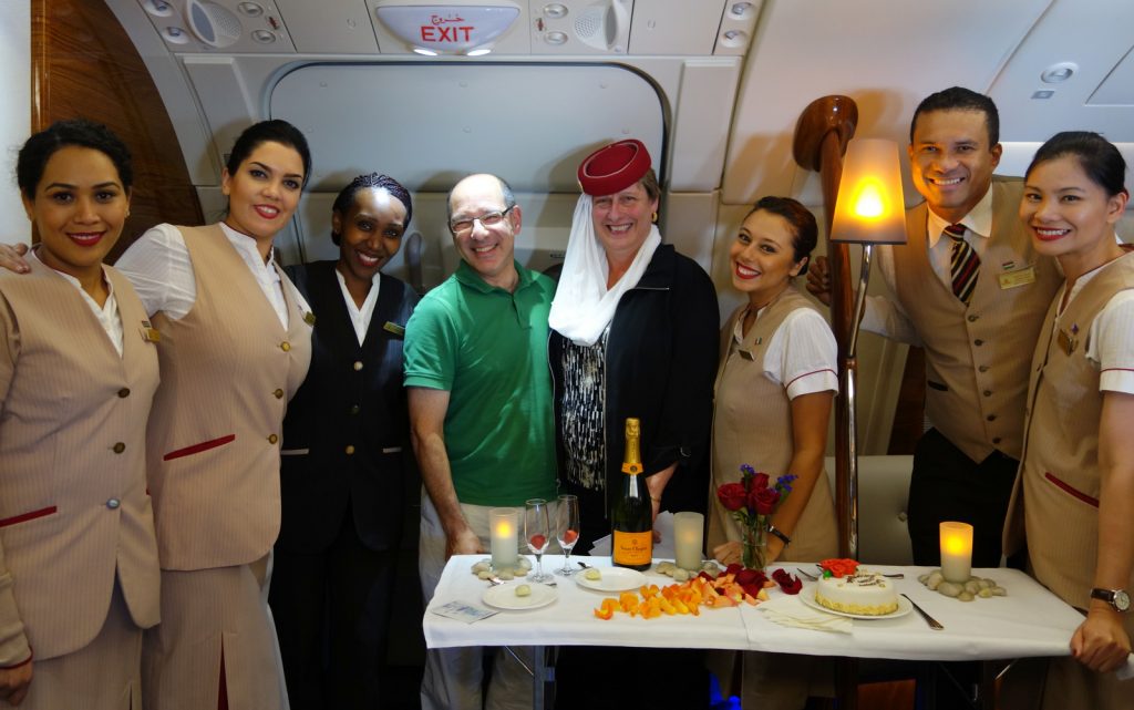 A surprise anniversary party at 40,000 feet! Karen got to wear Emirates' signature uniform hat. Maybe I should have too, to cut the glare.